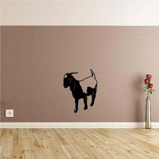 Black goat looking down wall decal