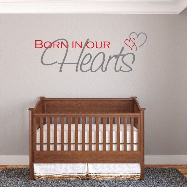 Wall decal text: "Born in our Hearts" with heart outline above.