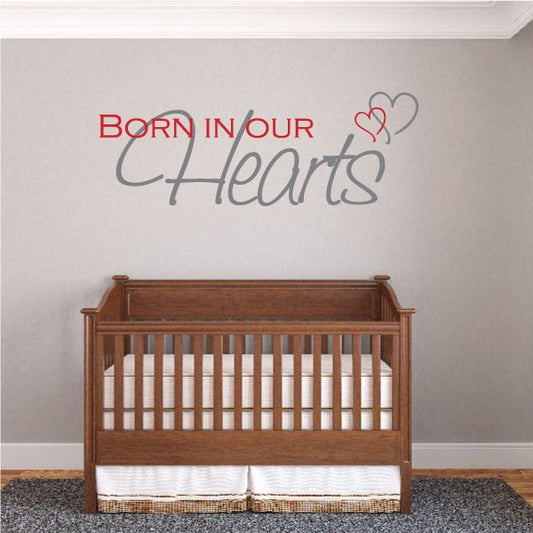 Wall decal text: "Born in our Hearts" with heart outline above.