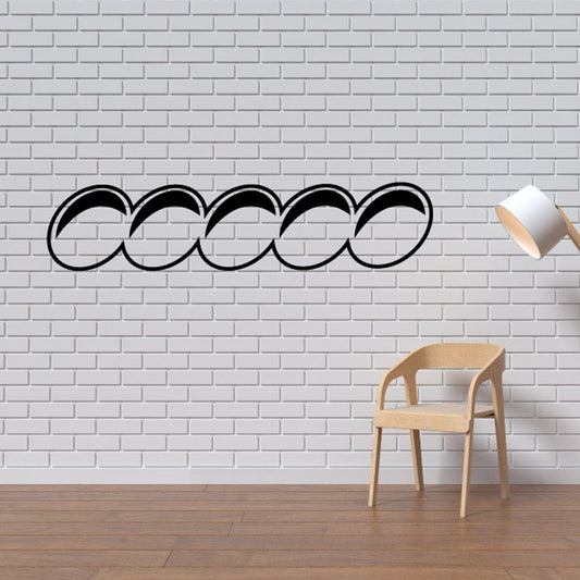 Black vinyl wall decal with interlocking circle lettering