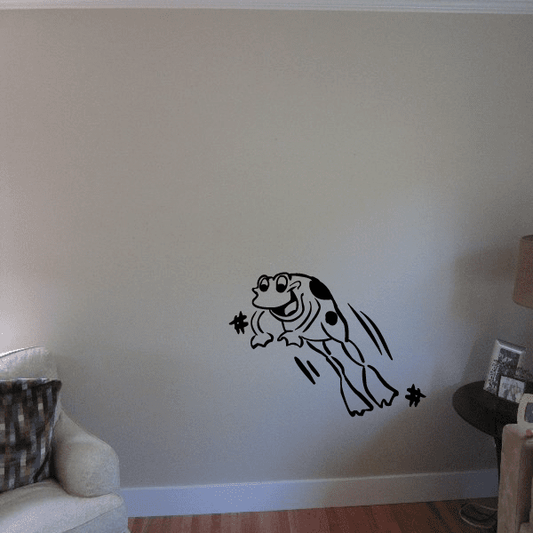 Cartoon frog wall decal, jumping and catching fly, black outline with small marks