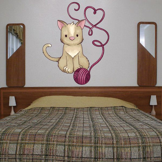 Cat with yarn heart decal: cream cat with pink yarn heart and loops