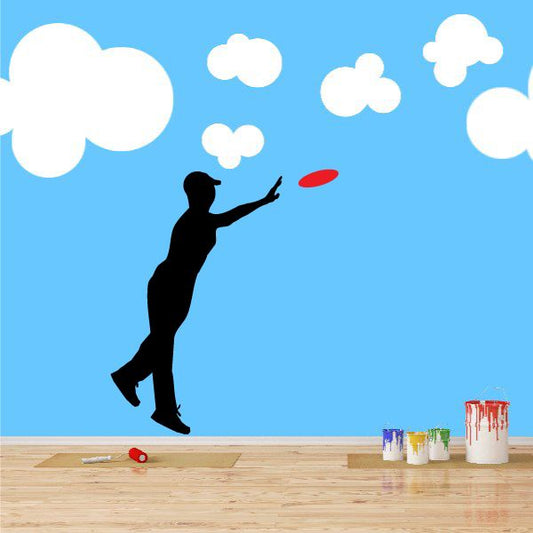 Wall decal: black frisbee-catching silhouette with red flying disc