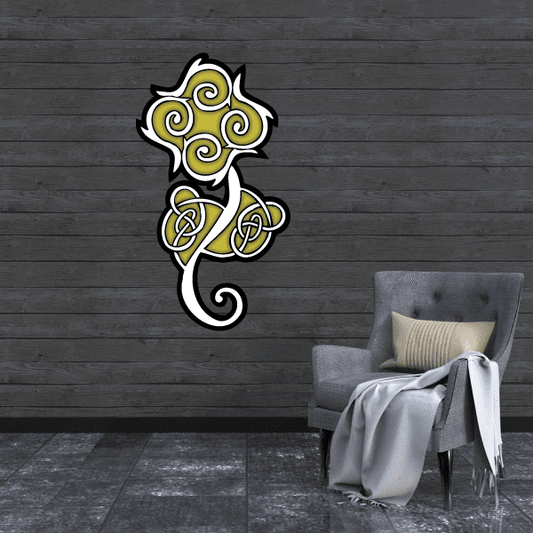 Celtic knot vinyl decal sticker with green and yellow swirls and black outline.