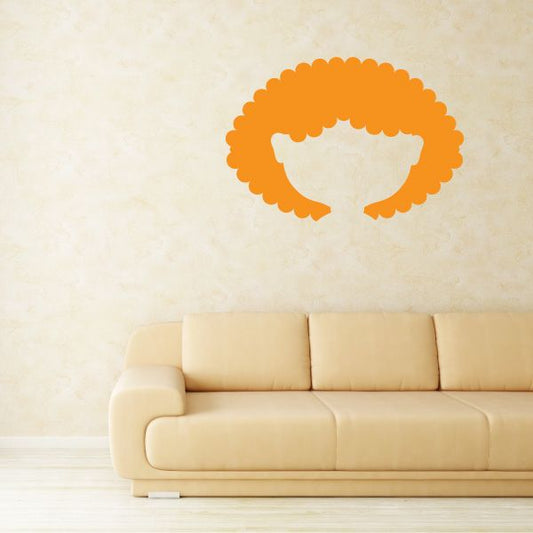 Orange character face wall decal with curly hair and blank white face cutout