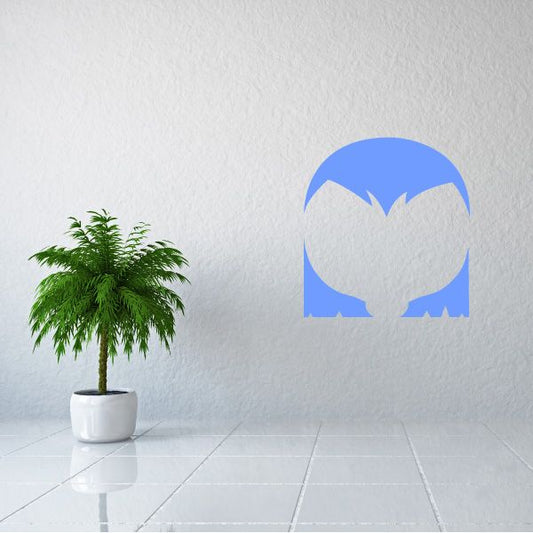 Vinyl wall decal of stylized blue character face with white highlights