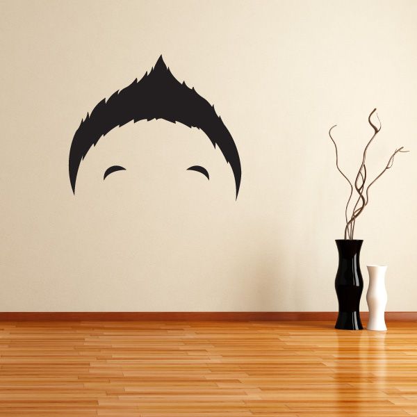 Vinyl wall decal with black stylized character face and eyebrows