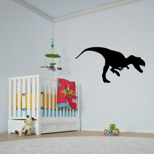 Black chasing dinosaur wall decal with smaller dinosaur figures, removable sticker