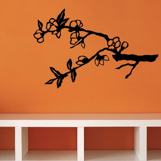 Cherry blossom tree branch vinyl wall decal with black silhouette flowers and leaves