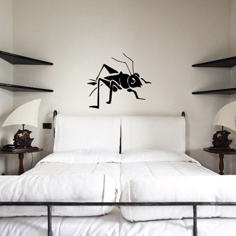 Black cartoon cricket playing a musical note wall decal