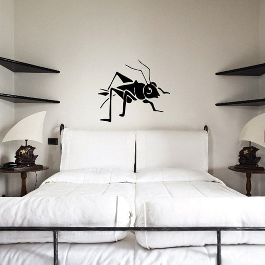 Black cartoon cricket playing a musical note wall decal