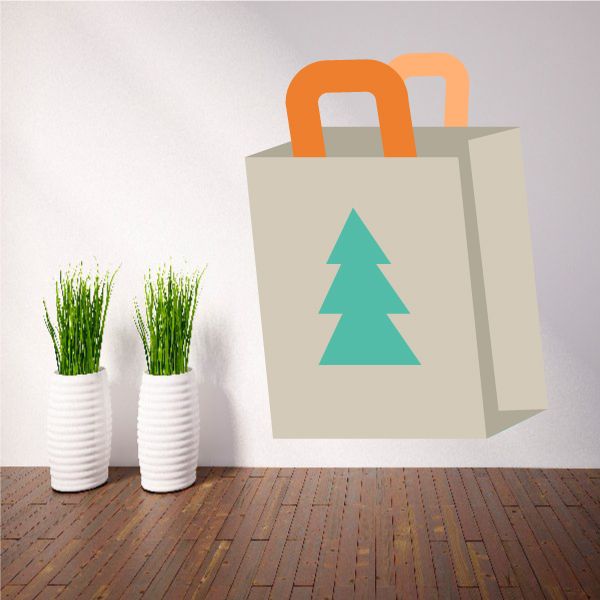 Christmas bag decoration sticker on a paper shopping bag, teal tree design