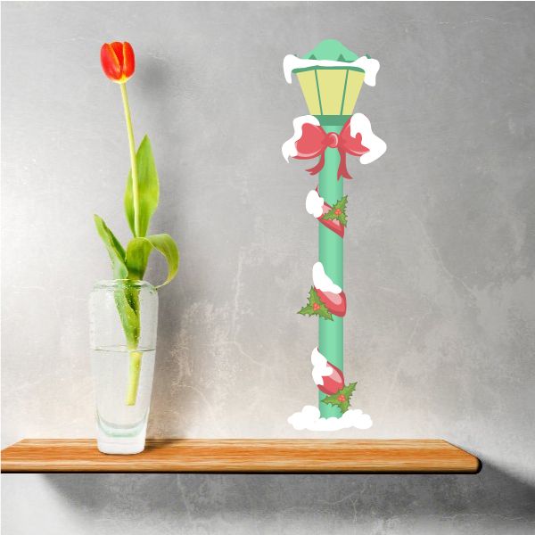 Christmas lamp post sticker with mint post, red ribbon bows, and white snow accents