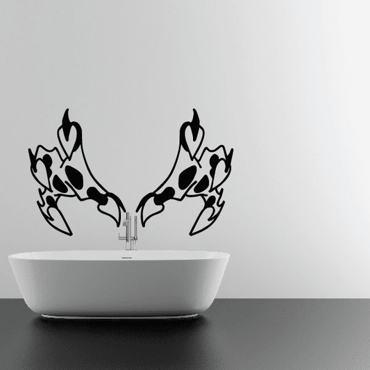 Decorative wall decals with two mirrored black claw silhouettes above a white sink basin.