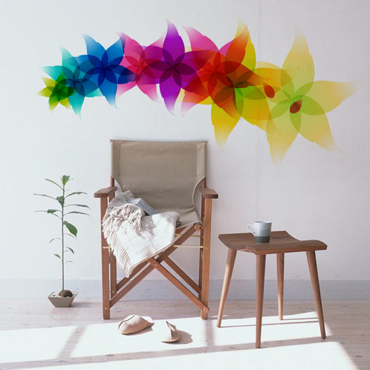 Furniture set against a wall decorated with leafy sticker designs