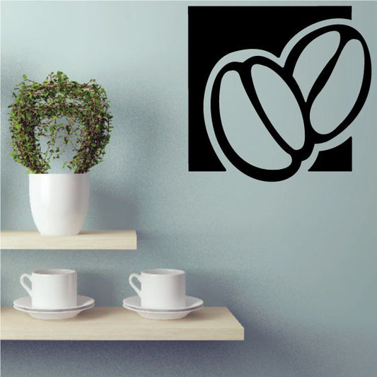 Coffee beans wall decal with stylized bean and cup icon on black square