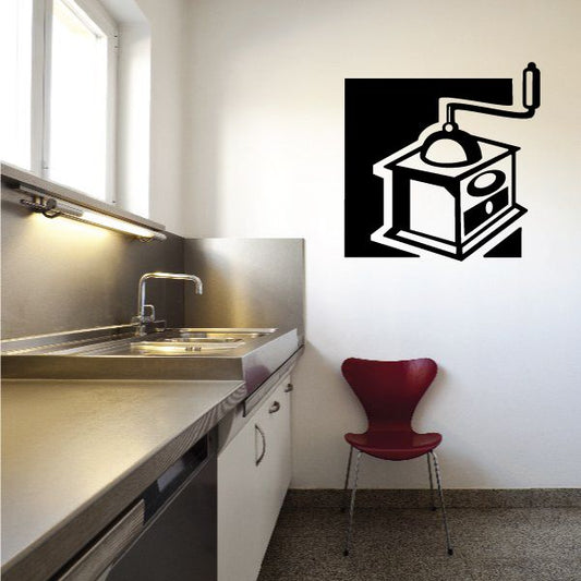 Coffee grinder box decal with black and white line-art grinder on a wall