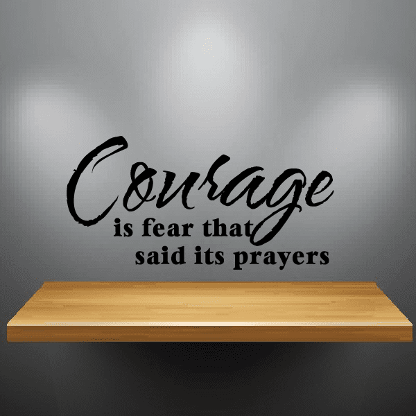 Wall decal with black script: Courage; 'is fear that said its prayers'.