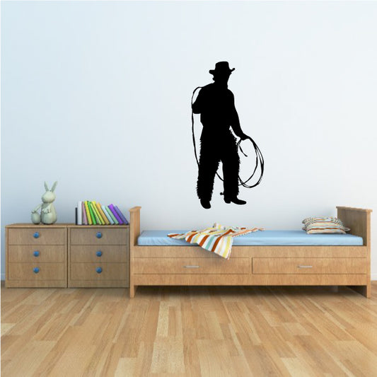 Action-packed cowboy lasso rope wall decal in a themed space