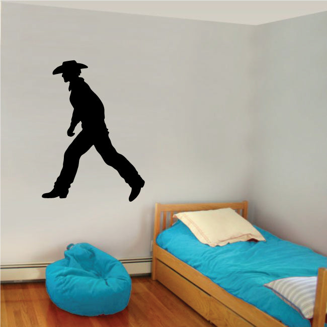 A wall in a child's room adorned with a cowboy-themed sticker