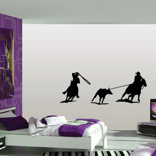 Cowboys on horses calf wrangling decal with black silhouette figures.