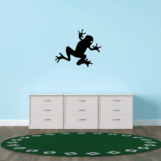 Black crawling frog decal with paw-print trail