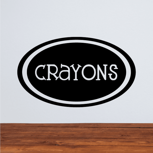 Oval black decal with white border and 'CRAYONS' text