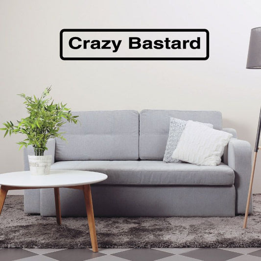 Wall decal with 'Crazy Bastard' text in black and white