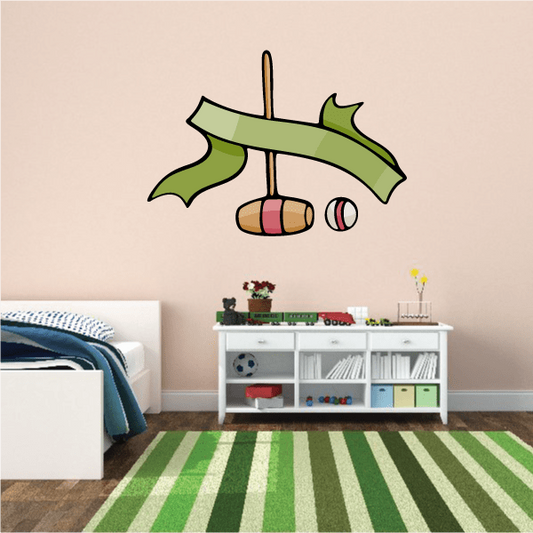 Green croquet-themed scroll decal with vertical stake and red/white balls