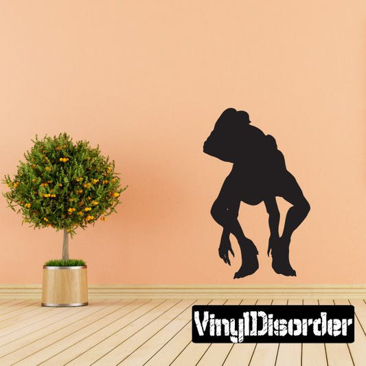 Crouching Dilophosaurus vinyl wall decal, dark dinosaur silhouette