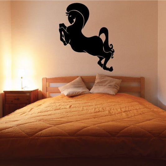 Horse jumping wall decal with black silhouette, curving leap pose