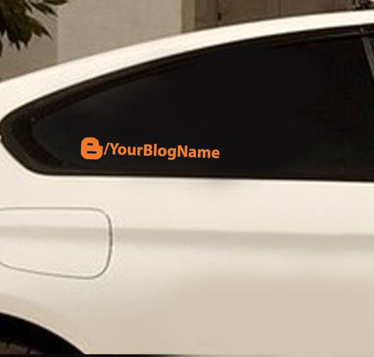 Custom blogger decal with orange icon and YourBlogName text on dark car window
