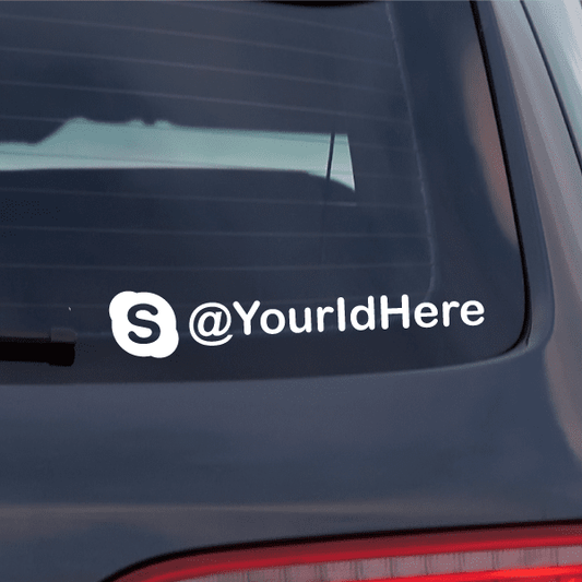 White die-cut decal with S @YourIdHere on a car window.