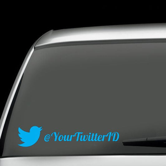 Twitter decal with blue bird icon and @YourTwitterID handle on a window