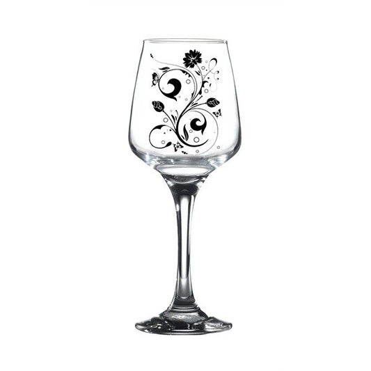 Wine glass with black floral swirl design on clear stemmed cup