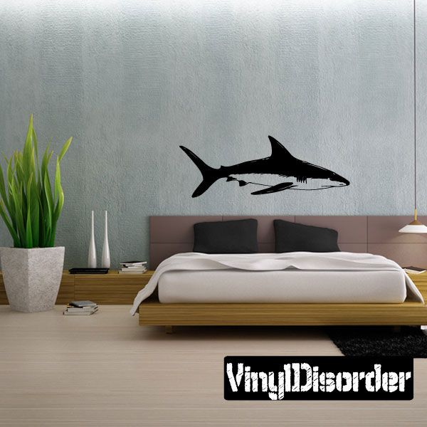 Shark wall decal featuring a black silhouette of a swimming shark.