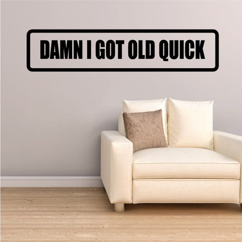 Wall decal with bold black text DAMN I GOT OLD QUICK on white rectangle