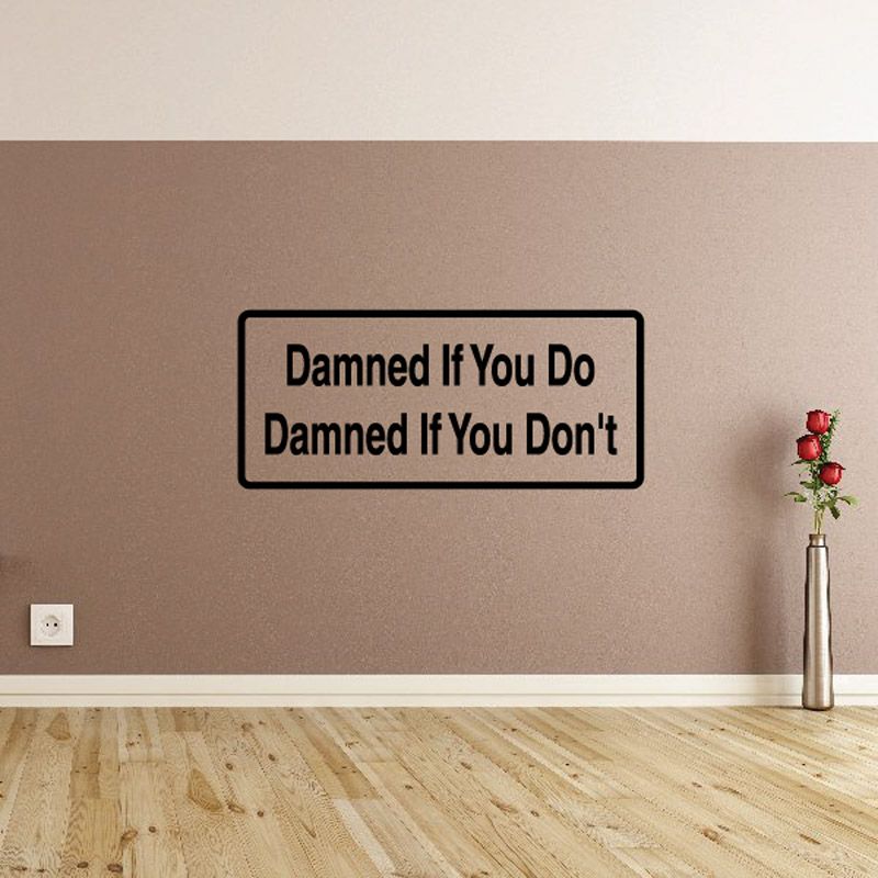 Wall decal with black text: "Damned If You Do Damned If You Don't"