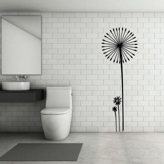A bathroom with a toilet area enhanced by a dandelion wall decal