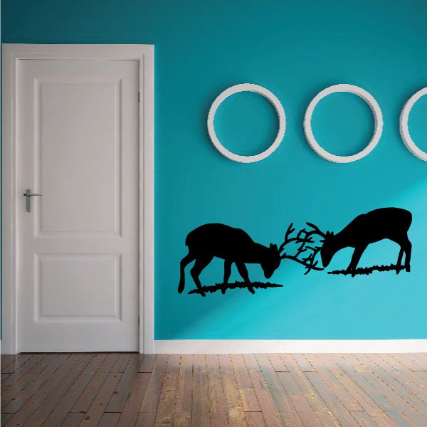 Black deer fighting decal with two deer silhouettes and intertwined antlers