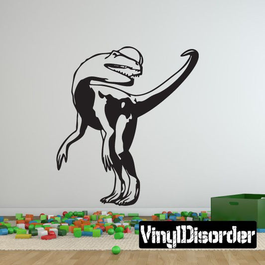 Black and white Dilophosaurus looking back wall decal with open mouth