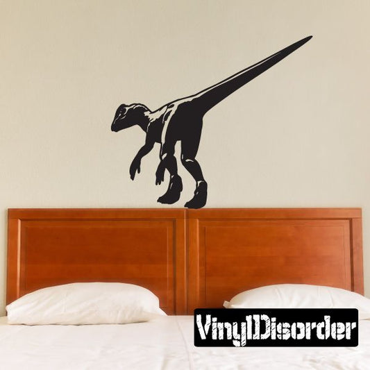 Black Dilophosaurus dinosaur wall decal with open mouth and crest