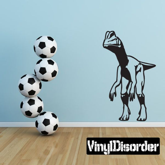 Dinosaur wall decal with black Dilophosaurus figure and four soccer balls