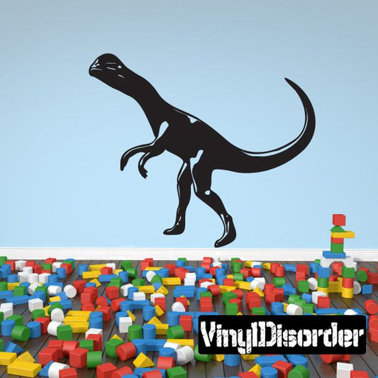 Black Dilophosaurus vinyl decal with open mouth and raised frill, standing