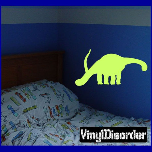 Neon green diplodocus wall decal silhouette with long tail and legs
