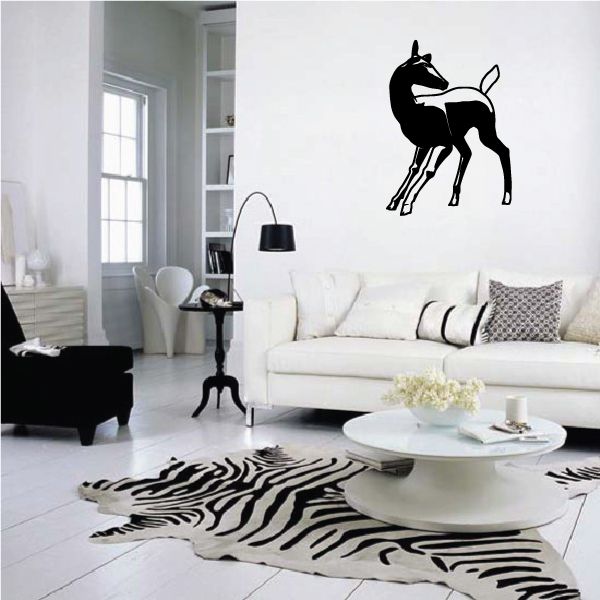Doe deer turned head decal, black silhouette of a doe on a wall