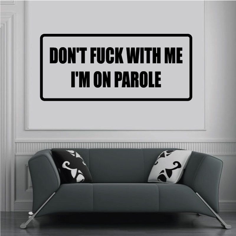 Rectangular black-and-white vinyl decal with bold text: I'm on parole.