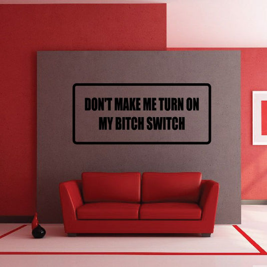 Wall decal with black bordered text box reading “DON’T MAKE ME TURN ON MY BITCH SWITCH”