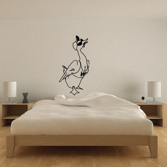 Goose wall decal in black line-art style, perched with a small hat and bow