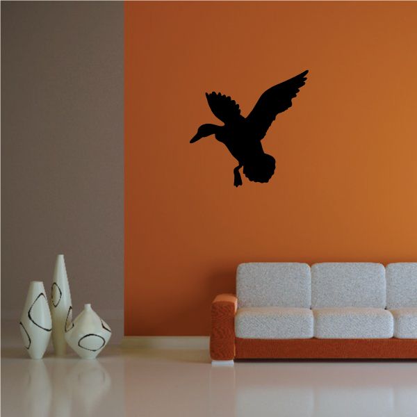 Black duck wall decal silhouette on a flat surface, vinyl style sticker.